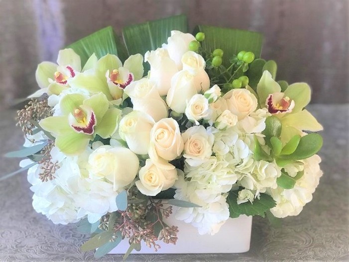 Low and Lush arrangement of creams, whites, and greens. 